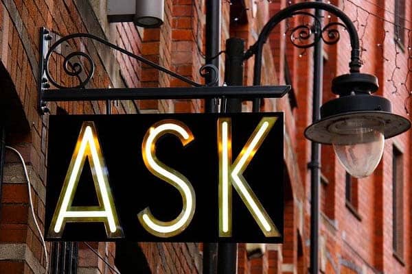 Photograph of a sign saying 'Ask'